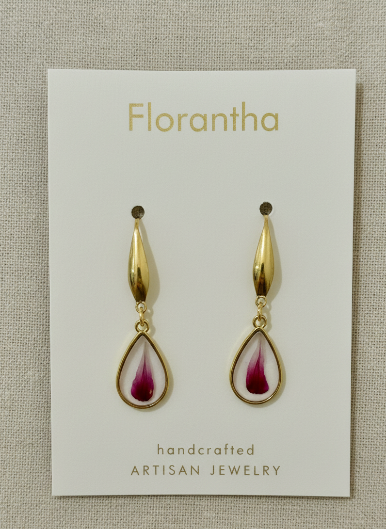 Florantha earrings on a branded card with a textured beige background