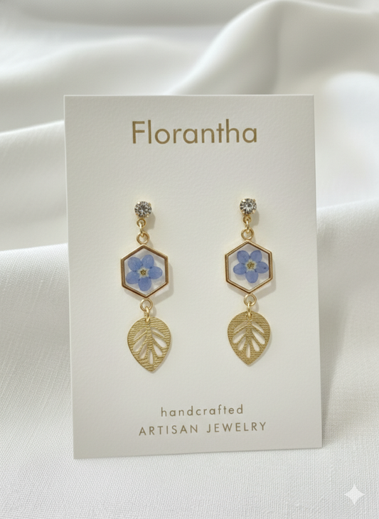 Florantha earrings on a branded card with a white background